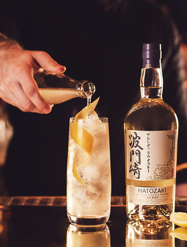 Barman pouring a Hatozaki whisky